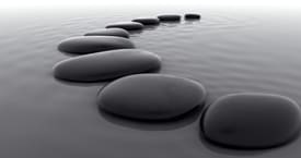 Peaceful Stones in calm water symbolize a peaceful mental state